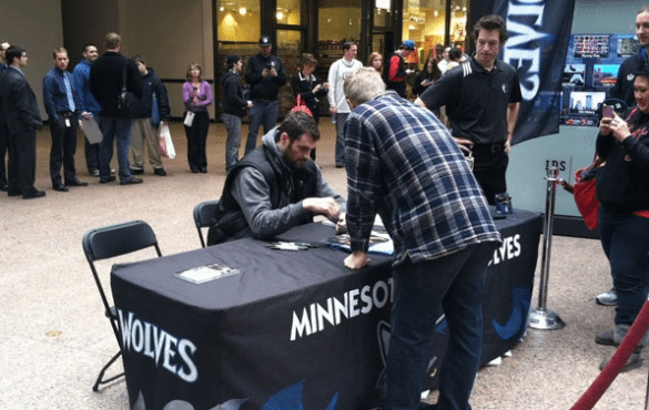 Kevin Love signs autographs for fans to kick off the Get Closer campaign